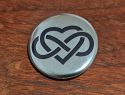 Button "XXVII" 