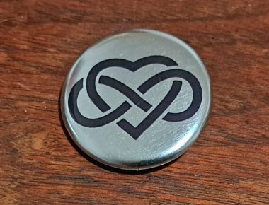 Button "XXVII" 